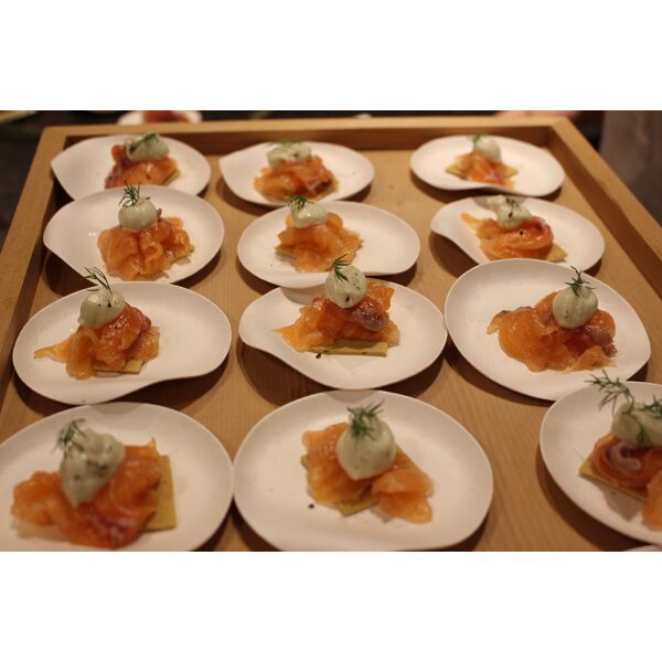 Maru Medium Round Plates filled with appetizer arranged on a table