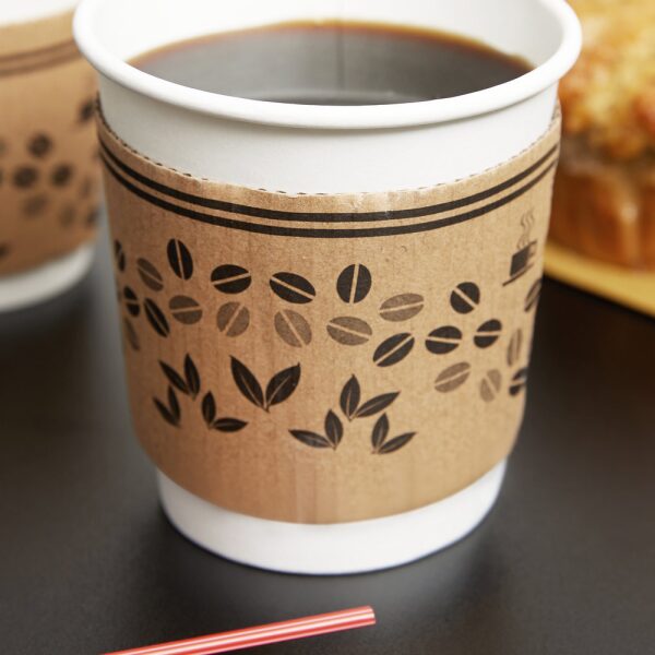 Printed Hot Cup Sleeve and a Cup of Coffee on a wooden table