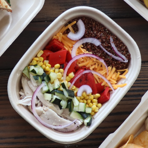 48 oz Fiber Food Container filled with food.